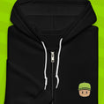 Load image into Gallery viewer, Black hoodie with a Mr. Stumble embroidered design on a green background