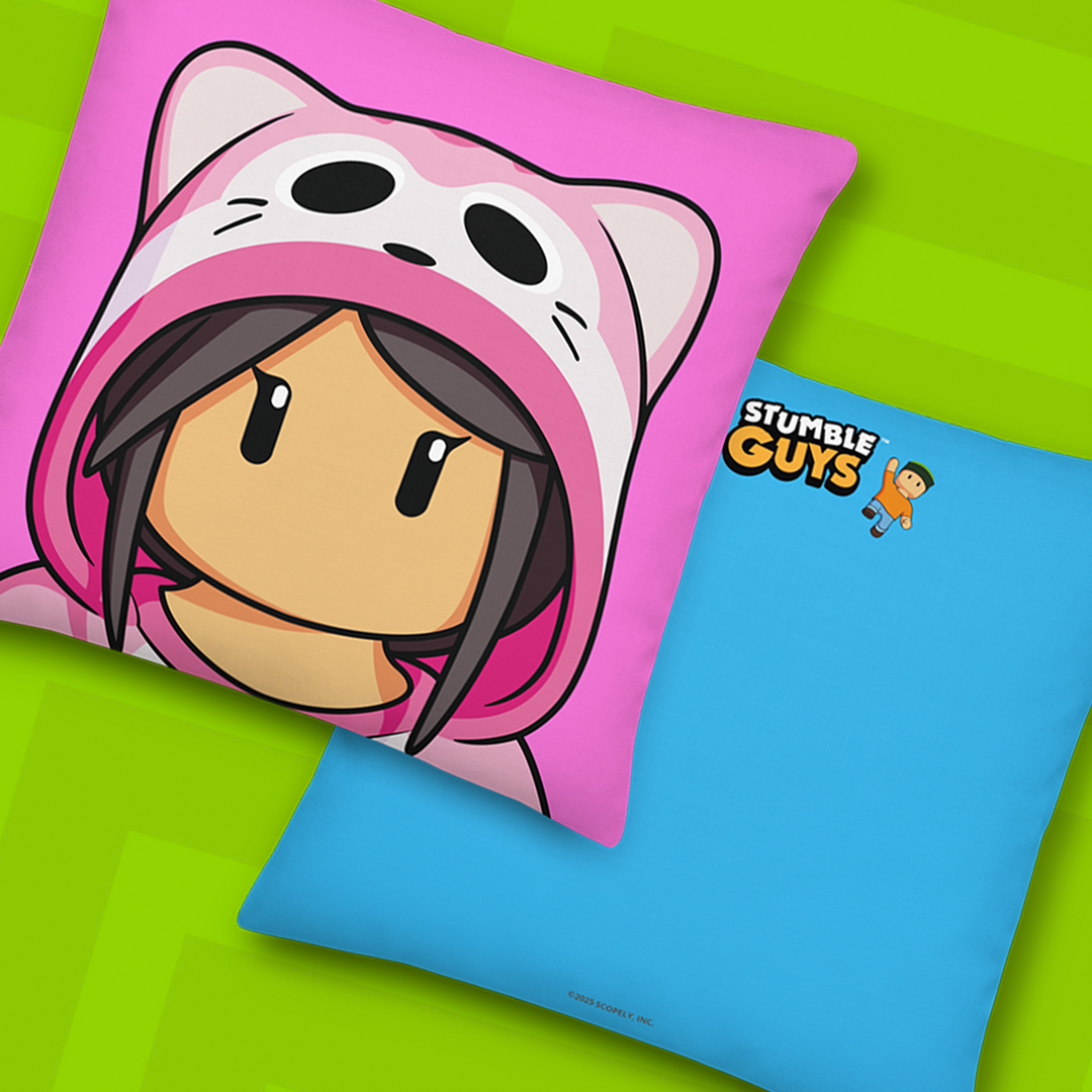 Mewomer pillow and blue pillow with 'Stumble Guys' logo on green background