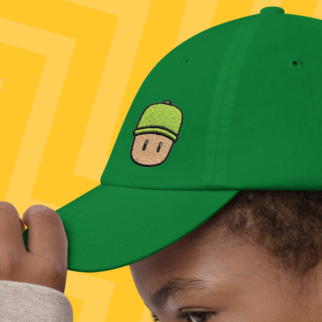 Green cap with a Mr. Stumble design on a yellow background