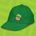 Load image into Gallery viewer, Green cap with a M. Stumble embroidered design on a green background
