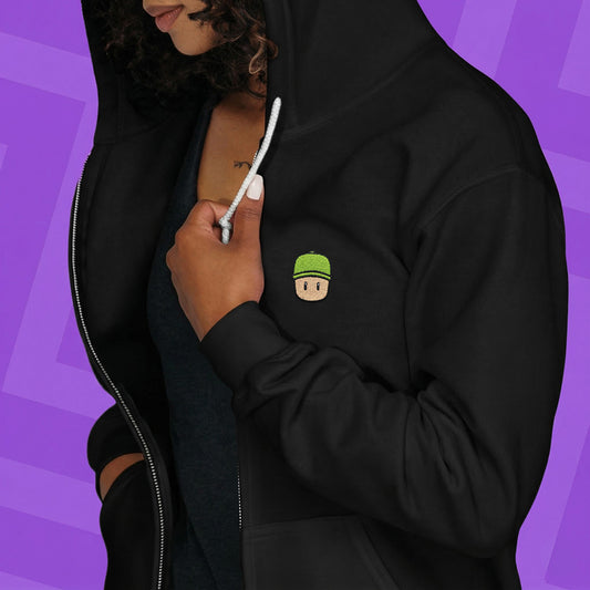Person wearing a hoodie with a Mr. Stumble embroidered design on the chest against a purple background