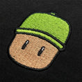 Load image into Gallery viewer, Embroidered Mr. Stumble patch on a black background
