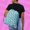Load image into Gallery viewer, Person wearing a blue drawstring bag with colorful Stumble Guys character pattern on a pink and purple striped background
