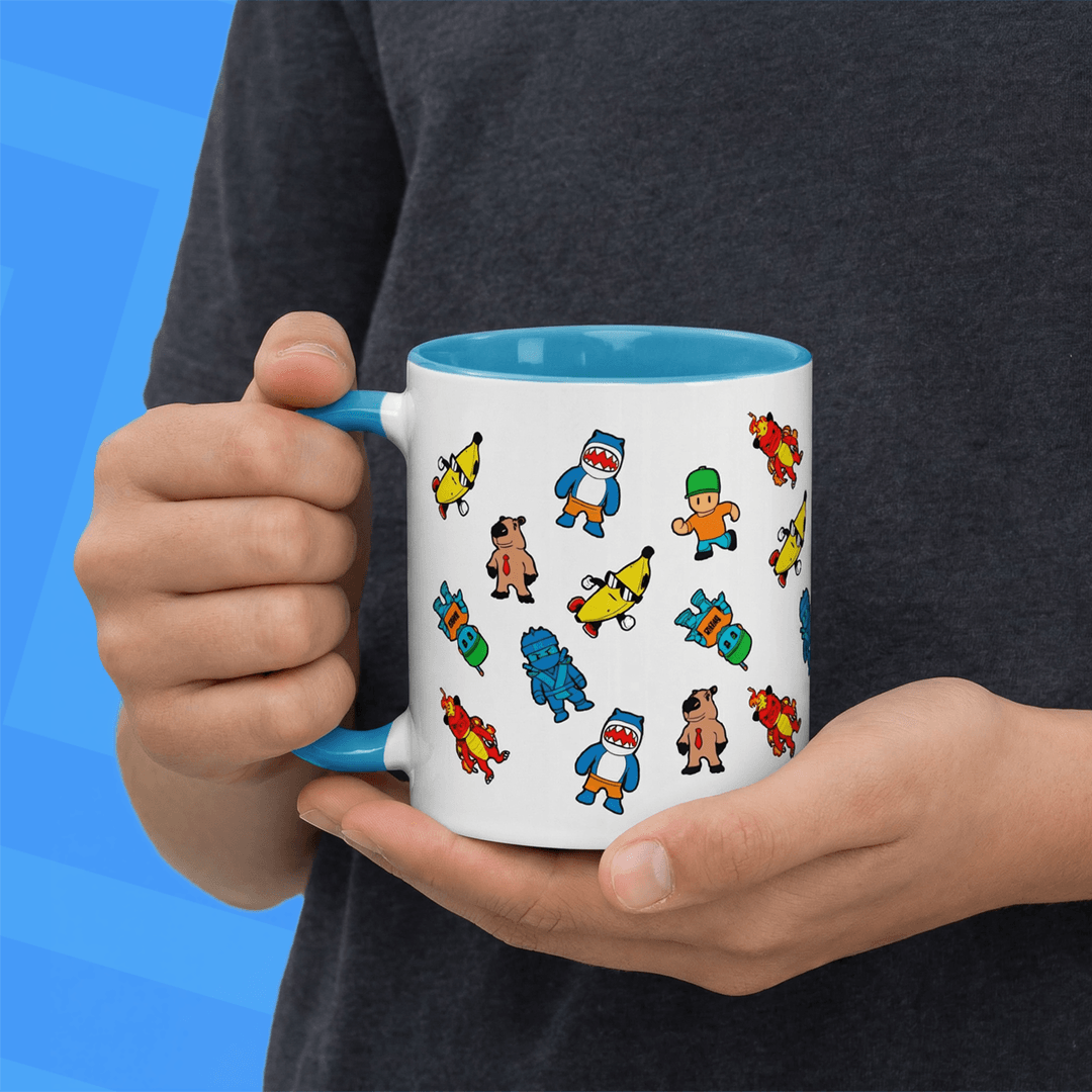 Person holding a stumble guys mug on a blue background