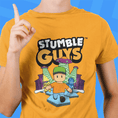 Load image into Gallery viewer, Person wearing a yellow 'Stumble Guys' t-shirt with a blue background
