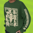 Load image into Gallery viewer, Green sewatshirt with 'Stumble Guys' graphic on a green background
