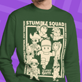 Load image into Gallery viewer, Green sweatshirt with 'Stumble Squad' graphic design on a purple background
